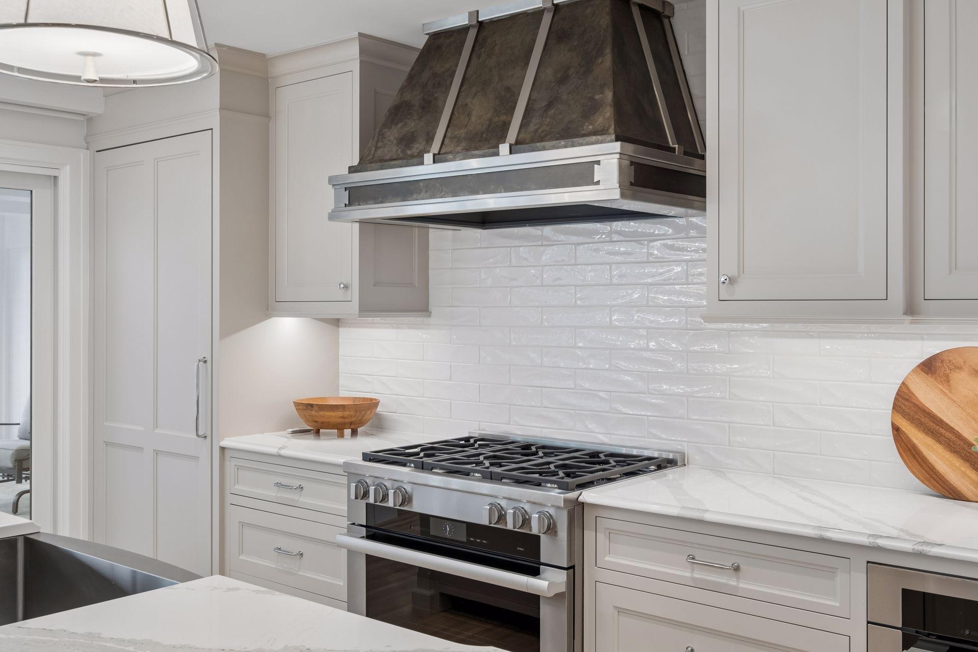 Gas stove with new hood and stylish backsplash
