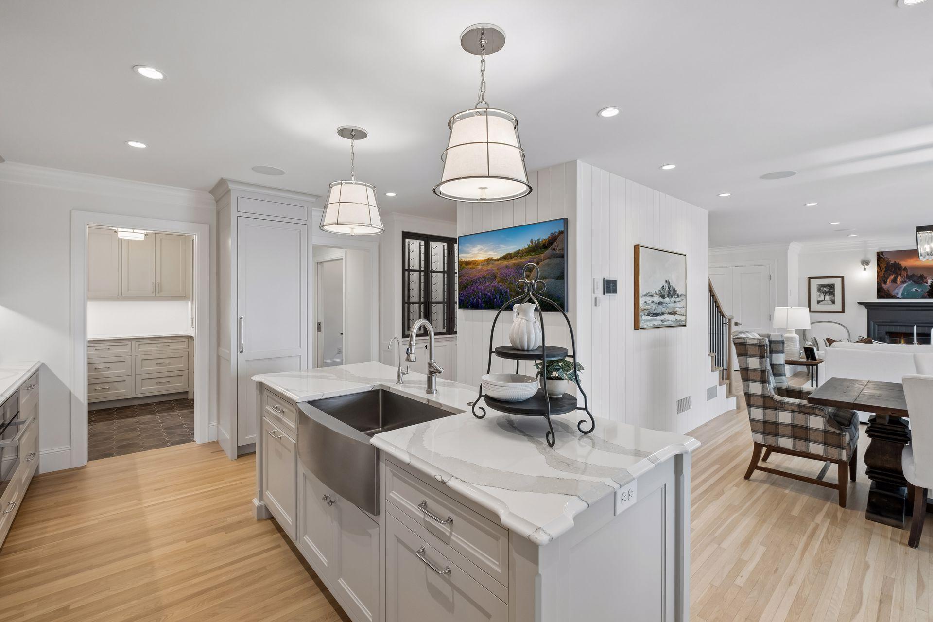 Kitchen features high end stainless steel appliances, spacious center island, and a walk-in pantry that was added