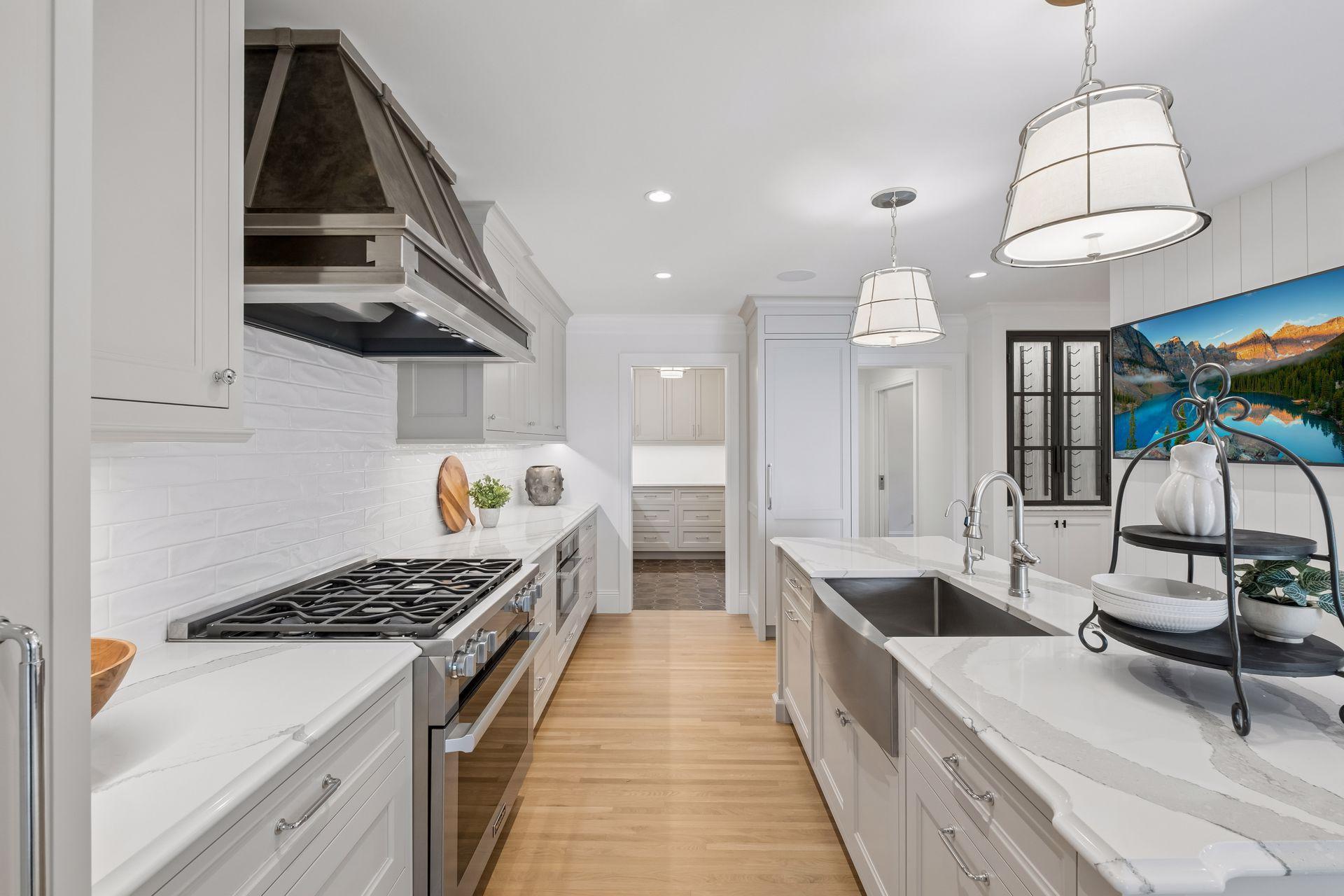 Kitchen features high end stainless steel appliances, spacious center island, and a walk-in pantry that was added