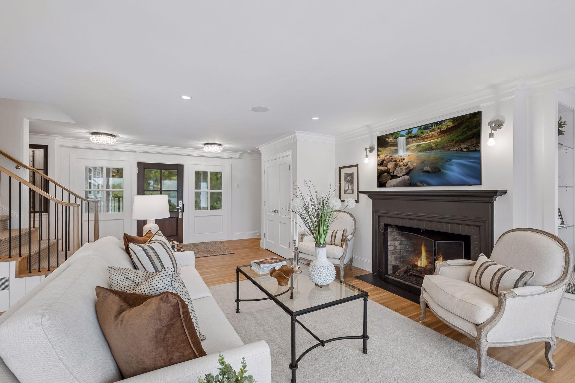 Hardwood flooring throughout and tons of natural light floods the main level