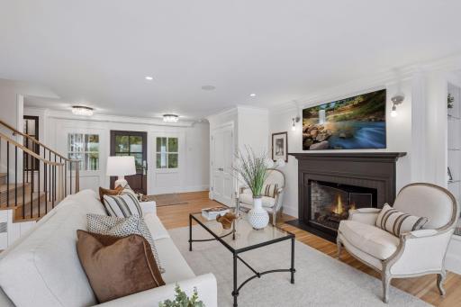 Hardwood flooring throughout and tons of natural light floods the main level