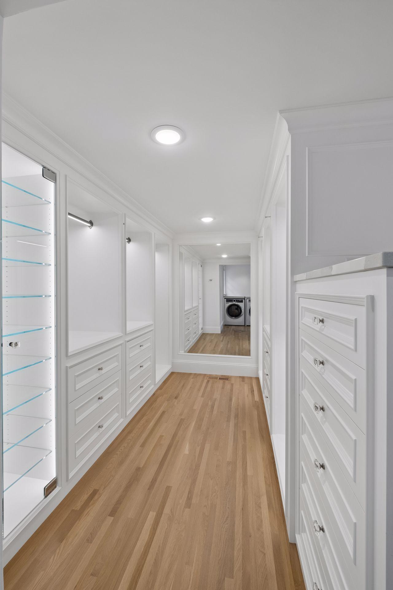Primary bedroom walk-in closet
