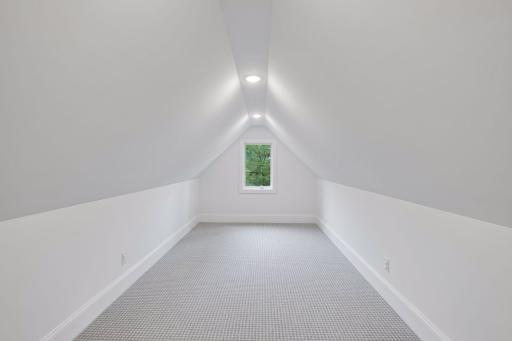 Fifth bedroom on the upper level with room for multiple beds, storage, or a hobby space