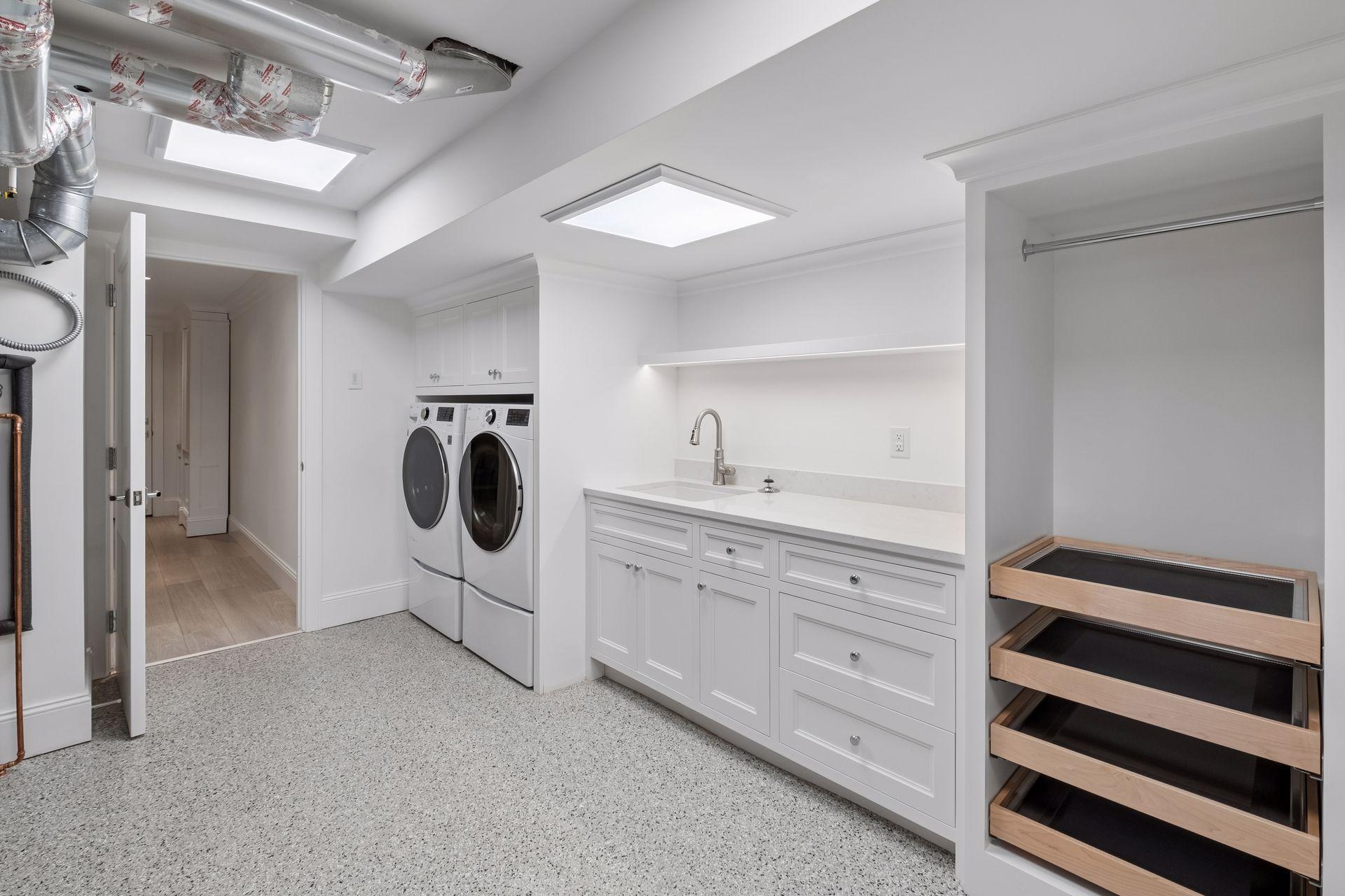Laundry located on the lower level with sink and drying rack