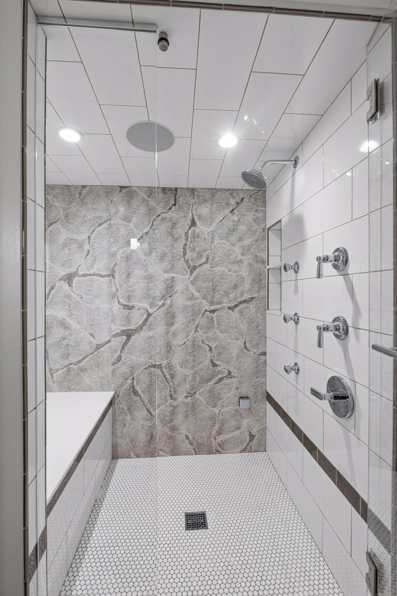 Lower level walk-in shower that is a steam shower