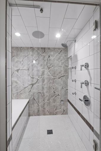 Lower level walk-in shower that is a steam shower
