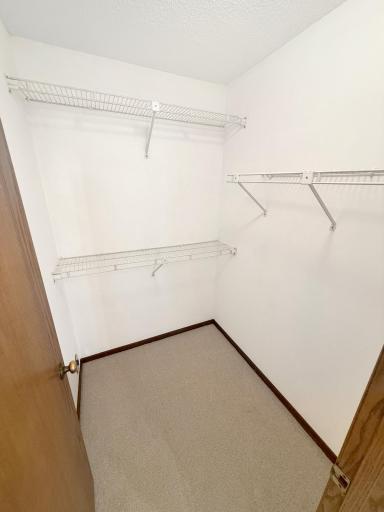 Primary bedroom walk-in closet