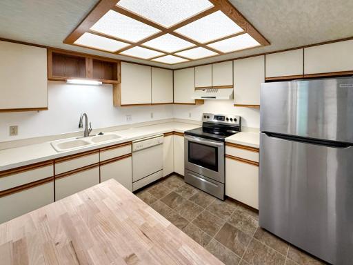 New butcher block island, perfect for cooking and hosting.