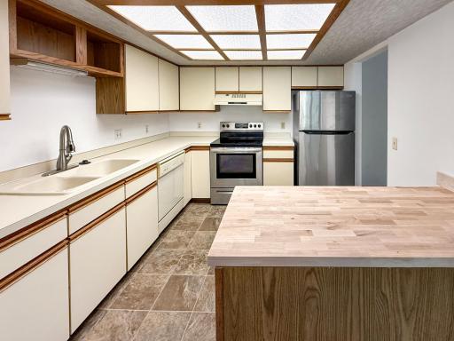 Spacious kitchen with abundant cabinet and prep space.