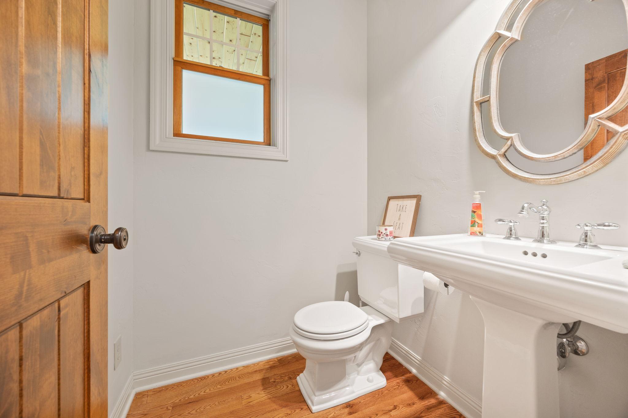 Main floor 1/2 bath steps away from your kitchen