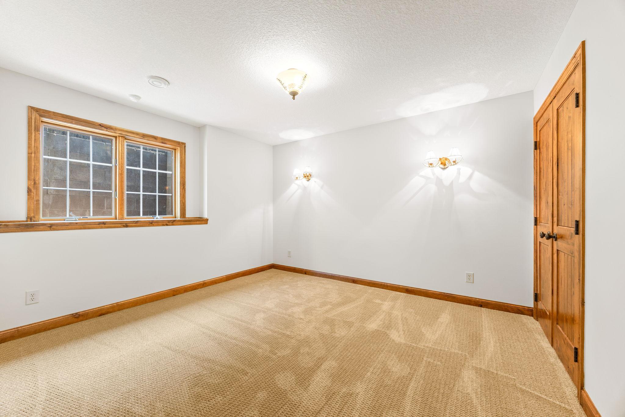 Bedroom three w/new carpet and egress. 12.5 x 11.5