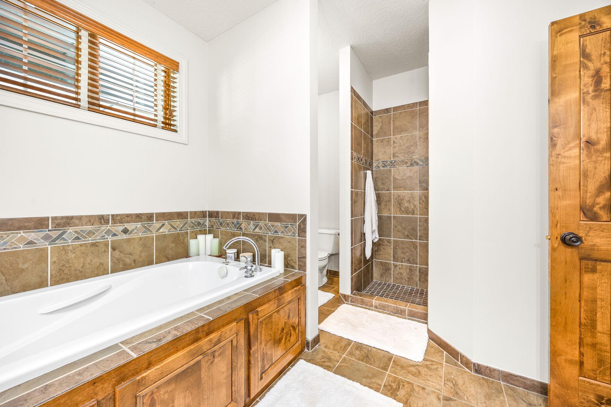 Walk in tiled shower.