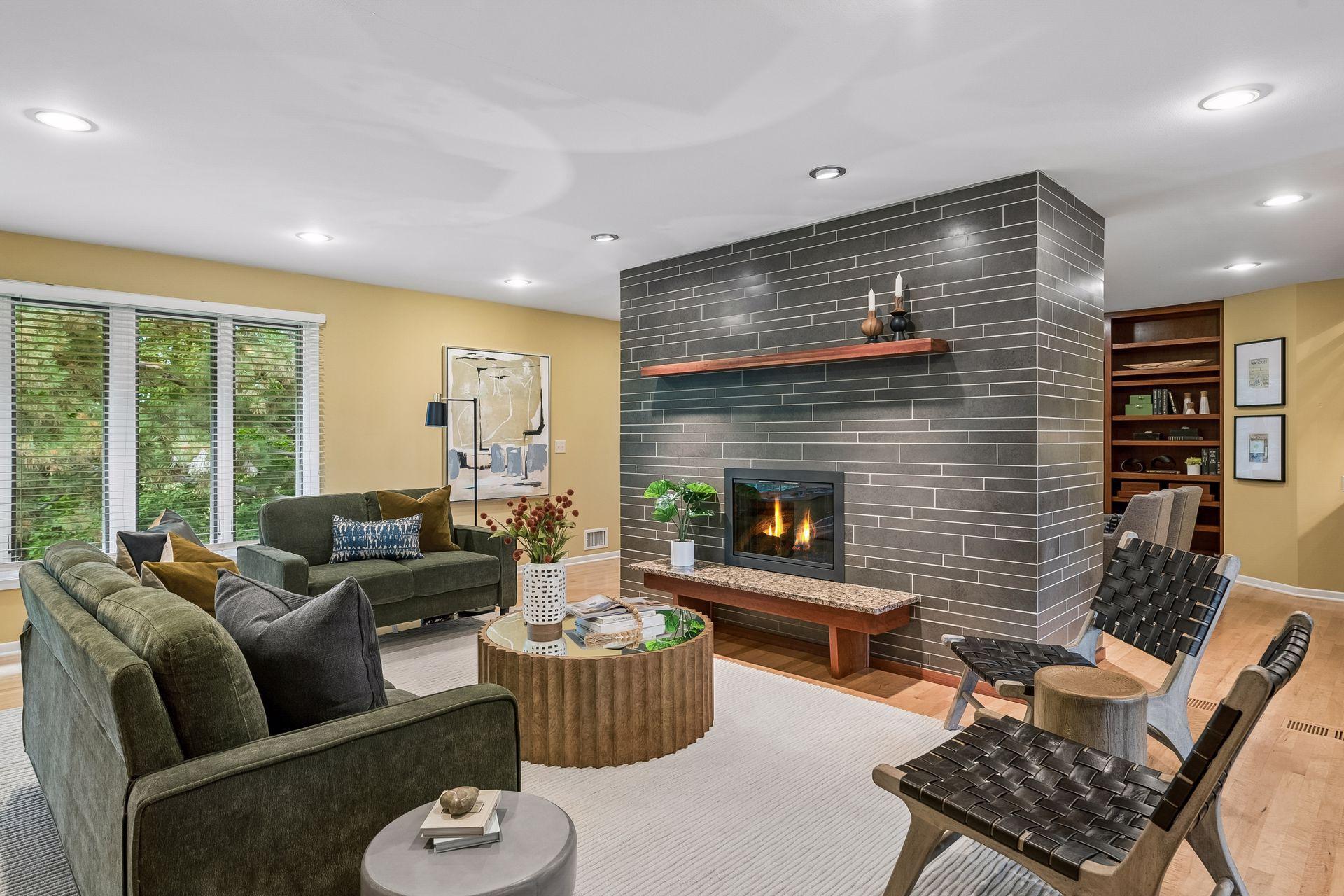 Gas Fireplace flanks the living room and cozy den