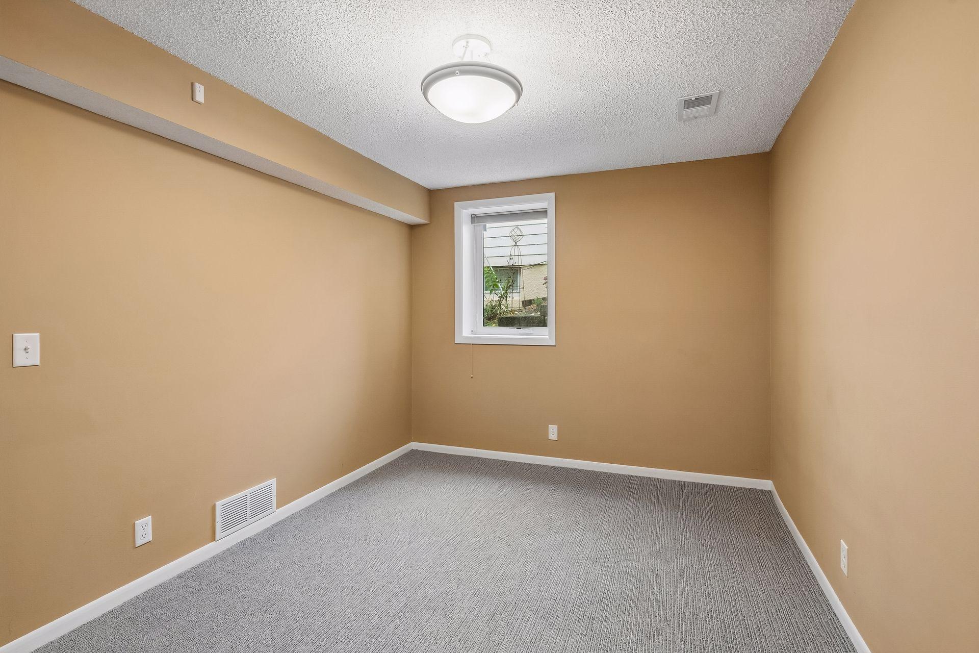 one of the two additional bedrooms in lower level.