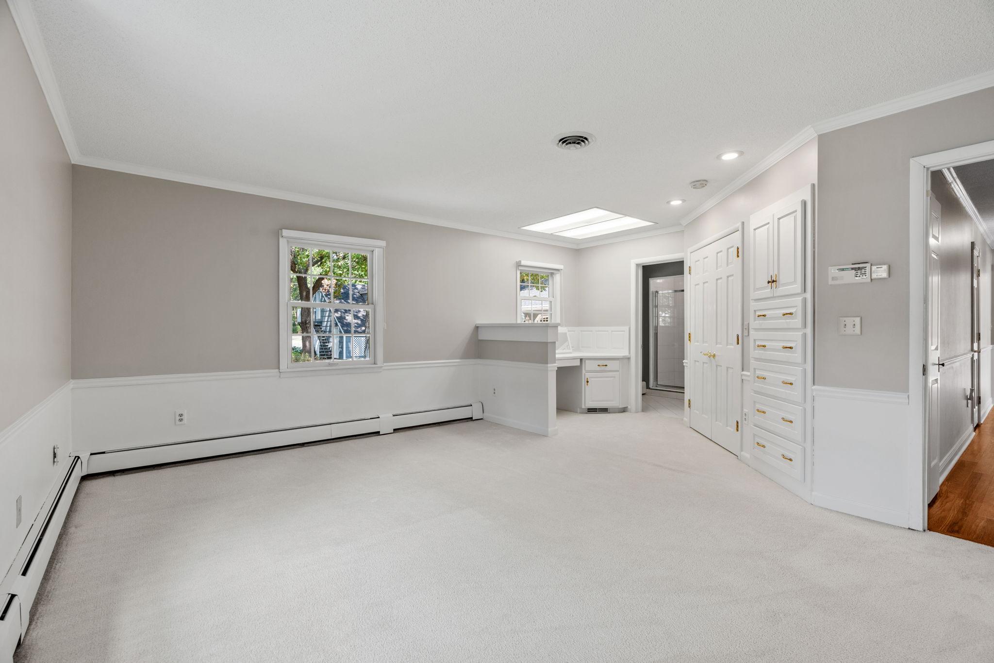 3rd bedroom with built in vanity area, and a spacious walk in closet + private 3/4 bathroom
