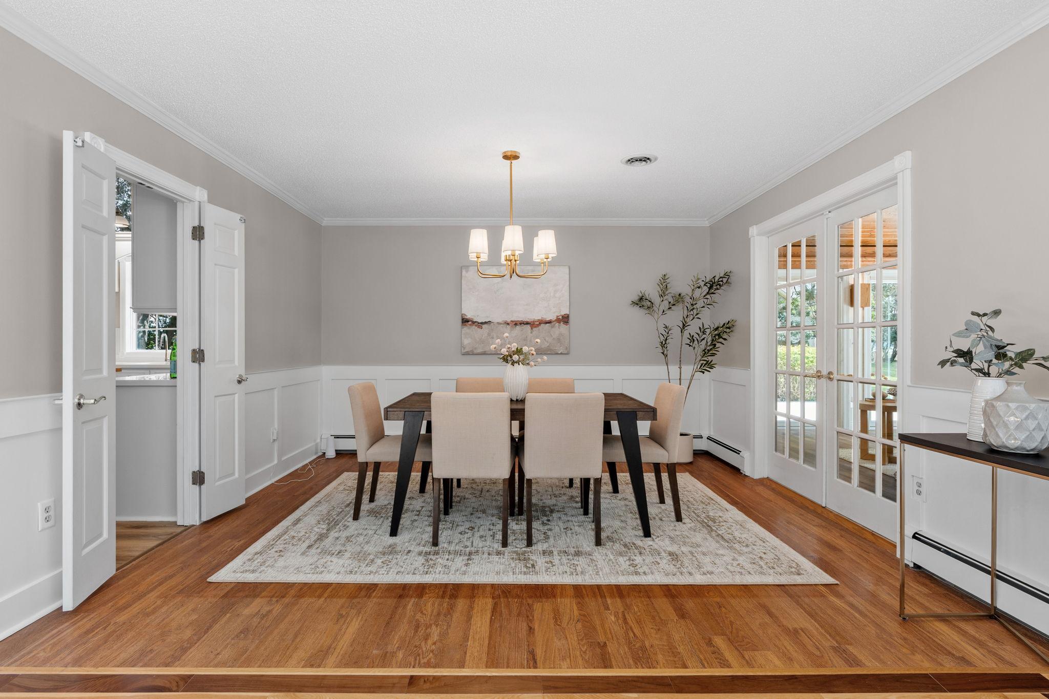 The dining area is conveniently located off the kitchen and features a new light and fresh paint.