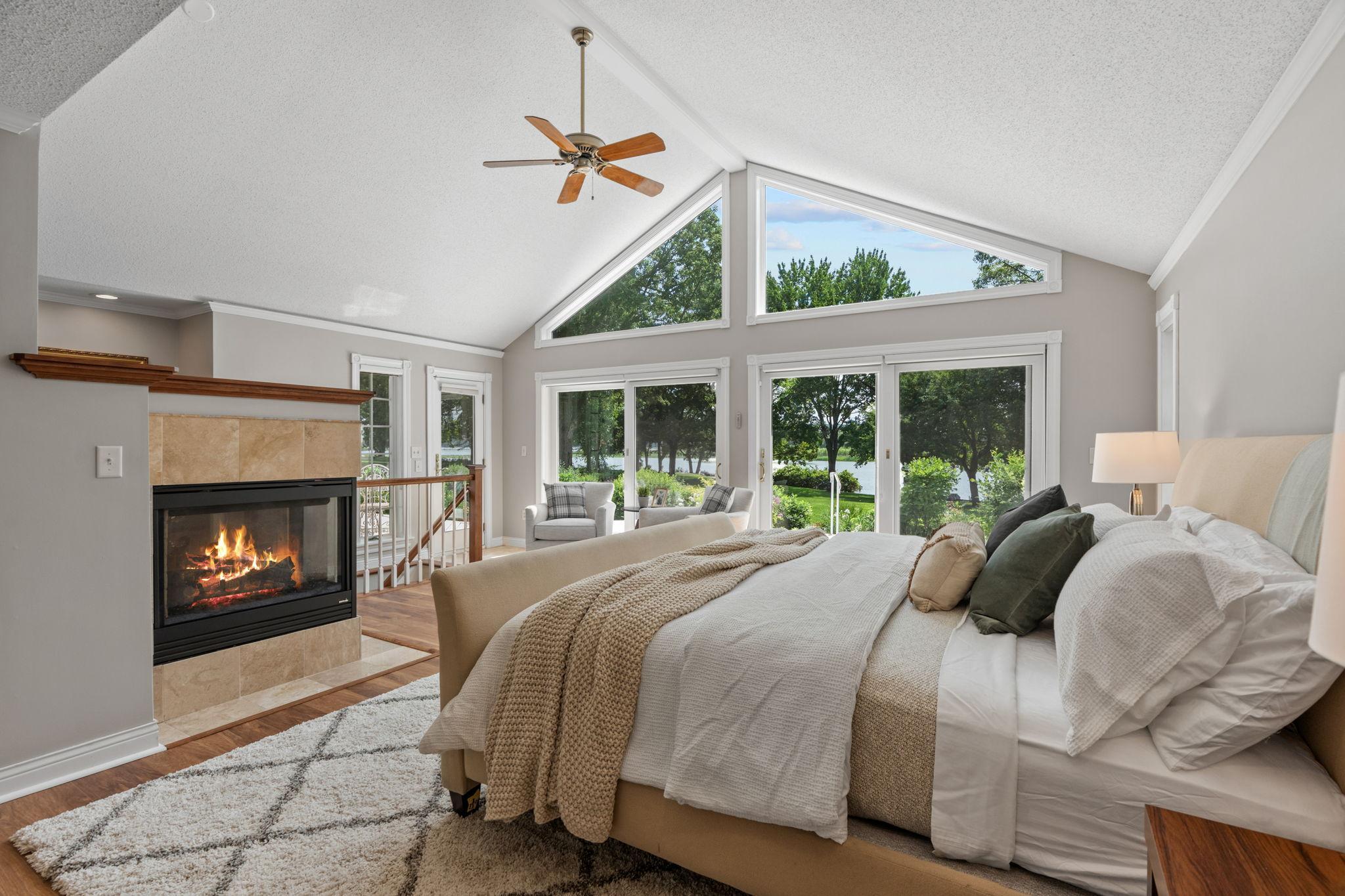 Welcome to your primary suite! Vaulted ceilings, gas fireplace, and access to the deck from your bedroom.