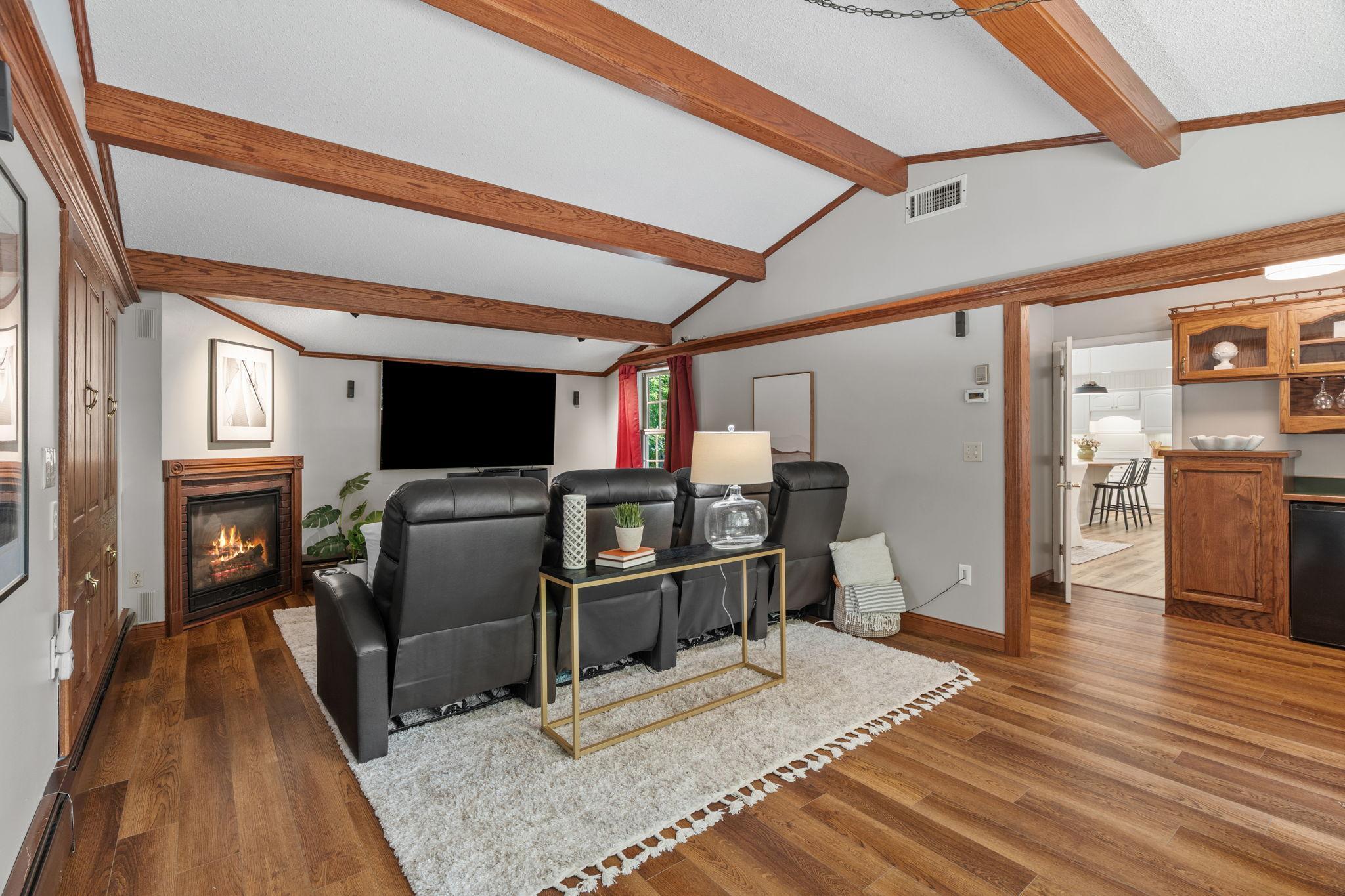 Fireplace in theater room for winter evenings, and easy access to the wet bar.