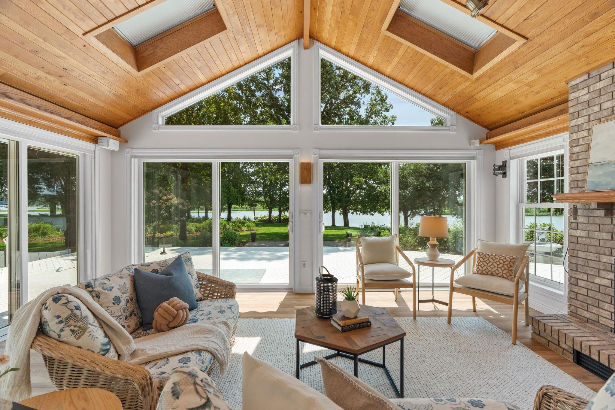 Your new favorite space - the sunroom! Vaulted ceiling, floor to ceiling windows, a fireplace, and new flooring all wait for you!