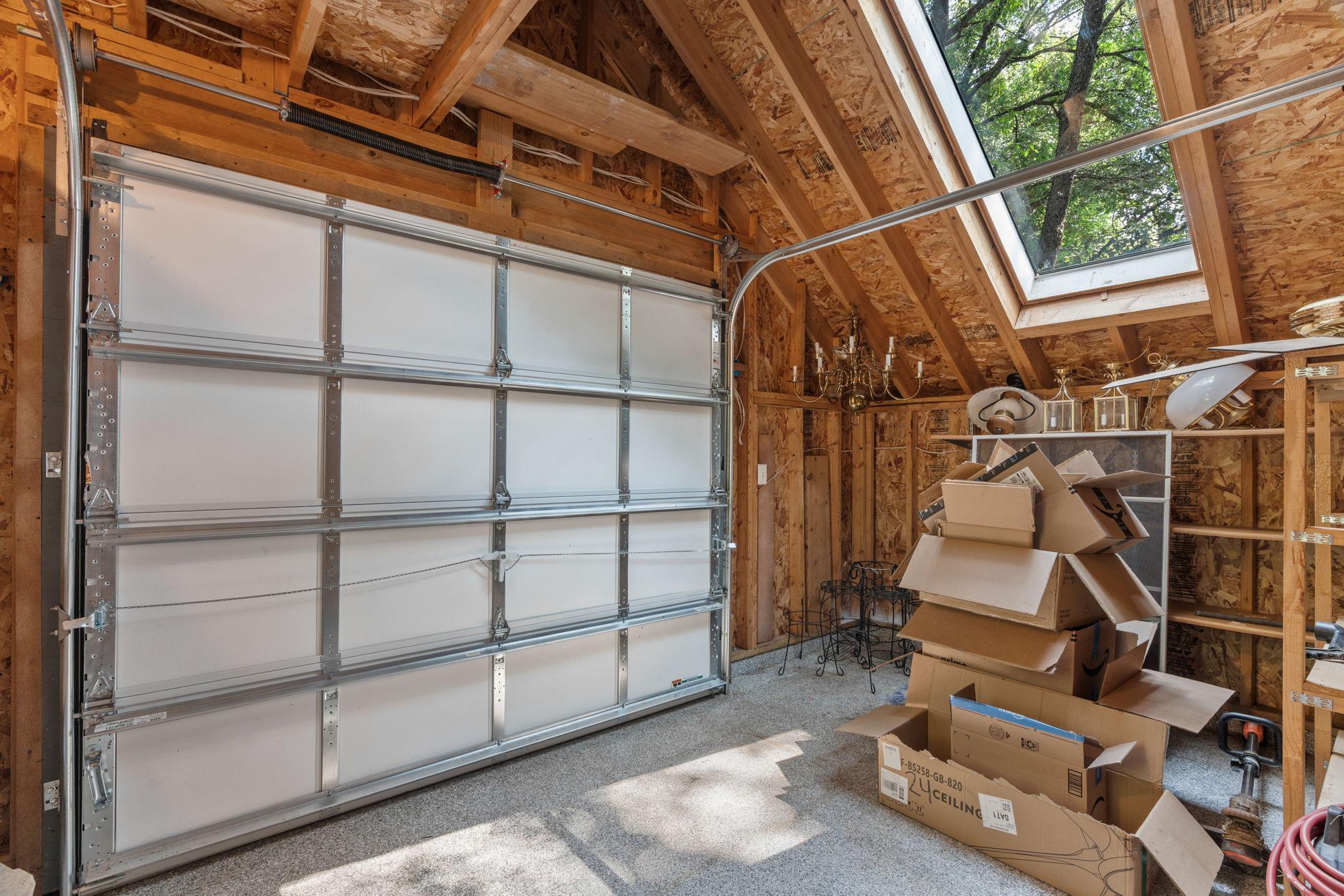 The potting shed has it's own skylight and garage door access.