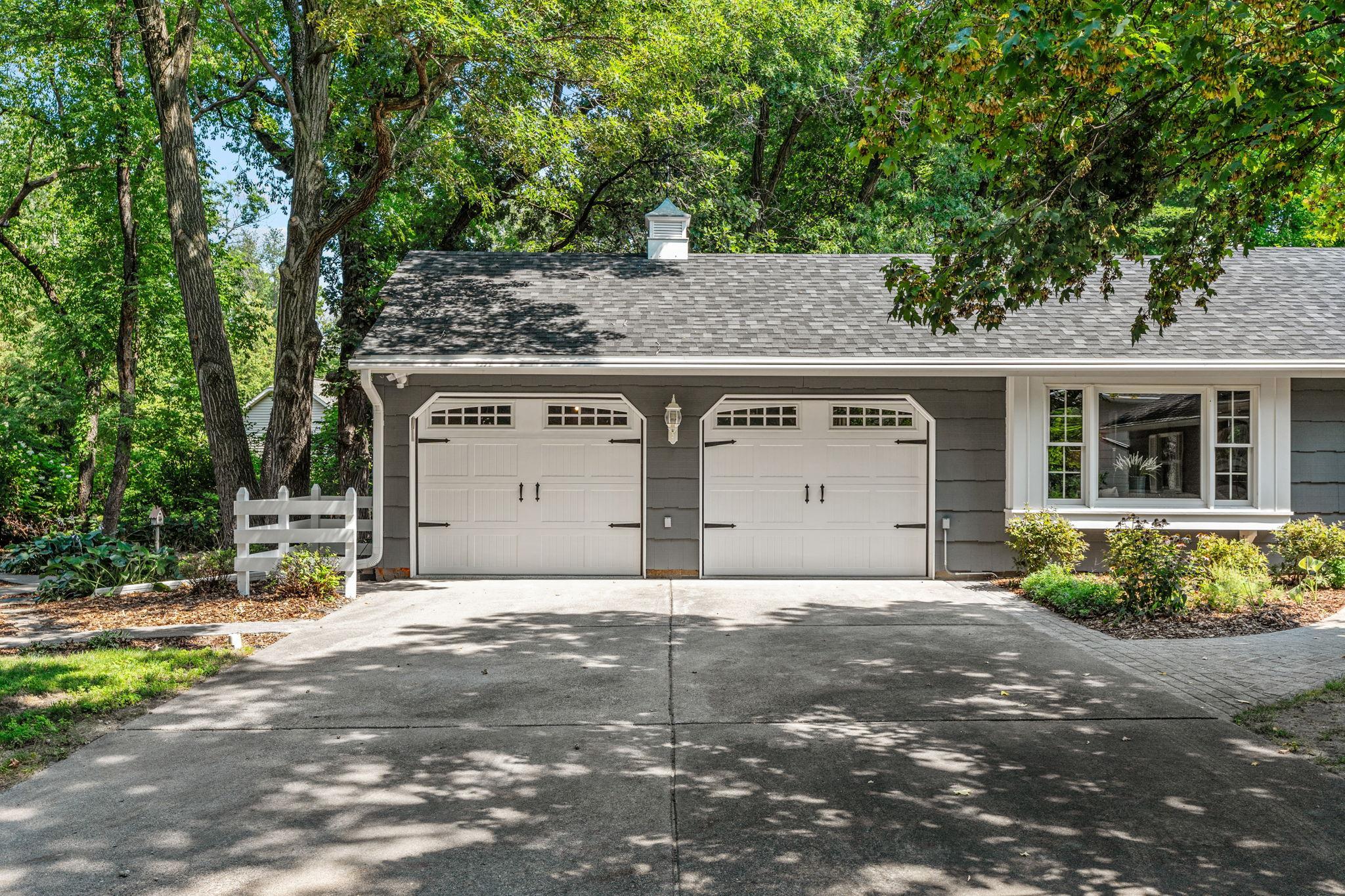 The attached garage includes a workshop space.