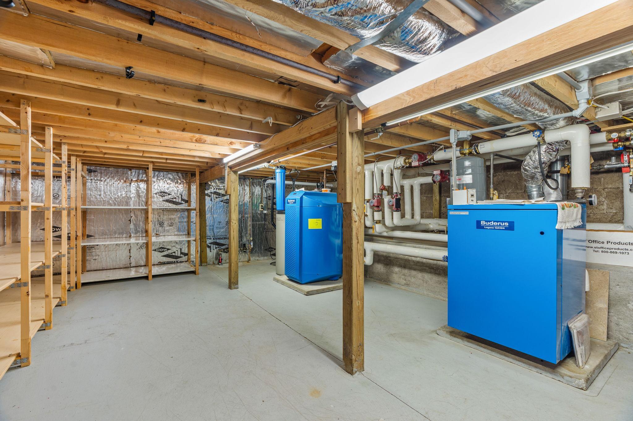 Crawl space with shelving - access via primary suite.