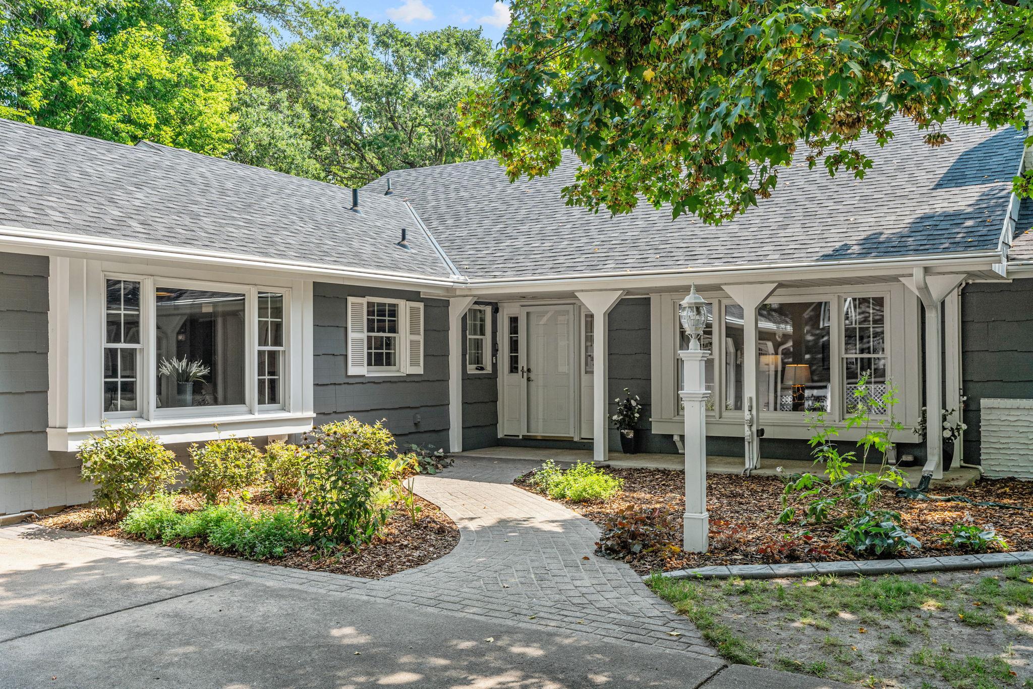 The welcoming front elevation has been recently landscaped with fresh mulch.