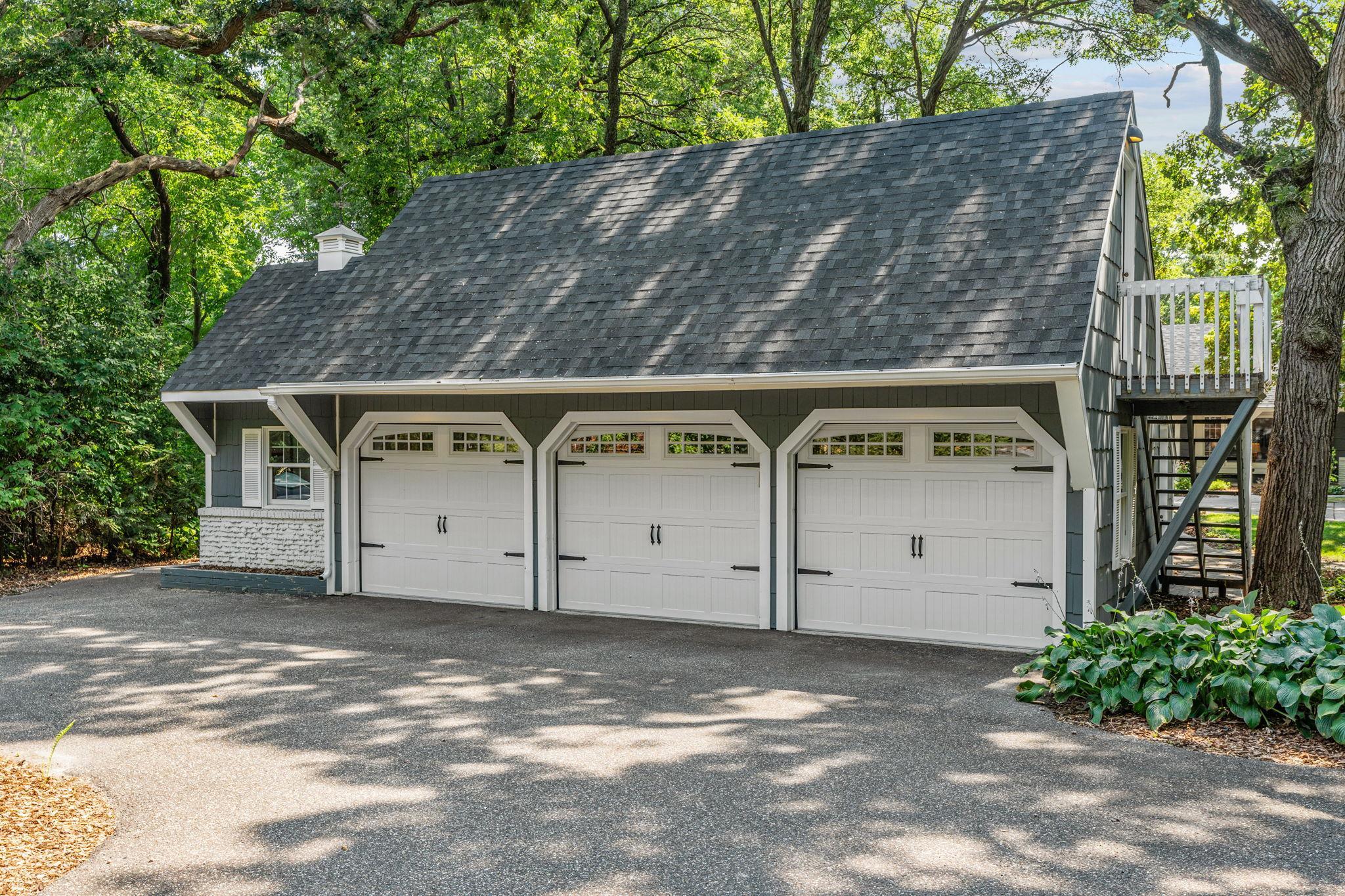 The detached garage provides 3 additional stalls, a potting shed, and a bonus room lovingly referred to as "The Cabana"