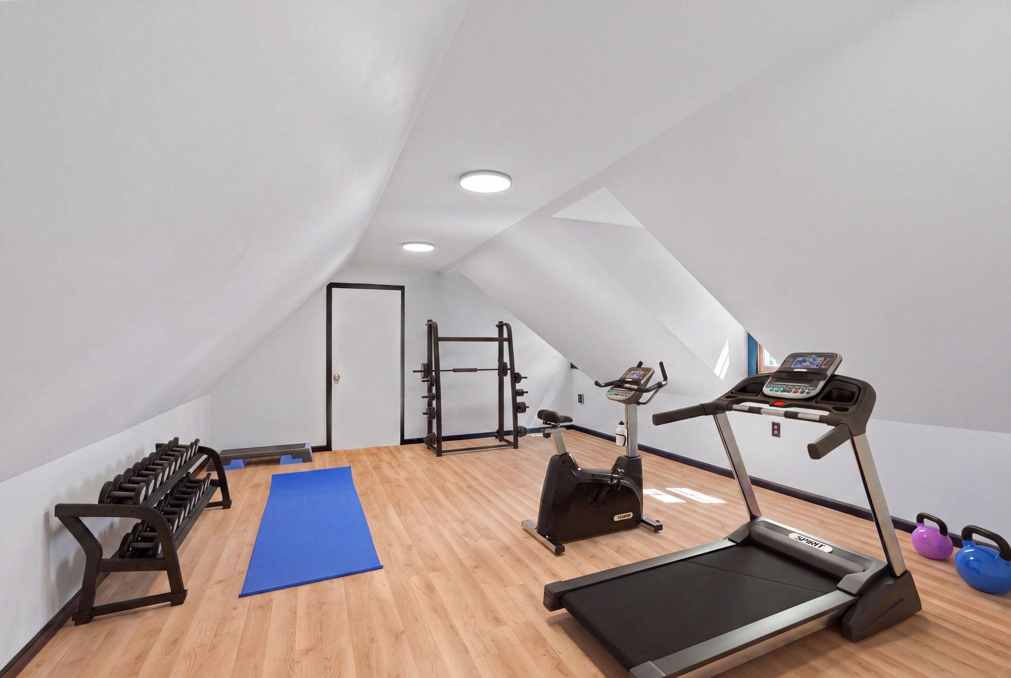 Bonus room virtually staged as a home gym.