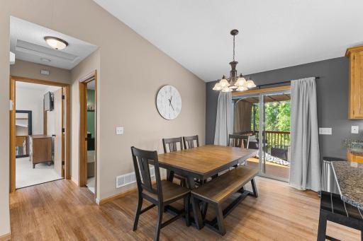 Main Floor Dining Room with hardwood Floors & Walkout to Large Deck