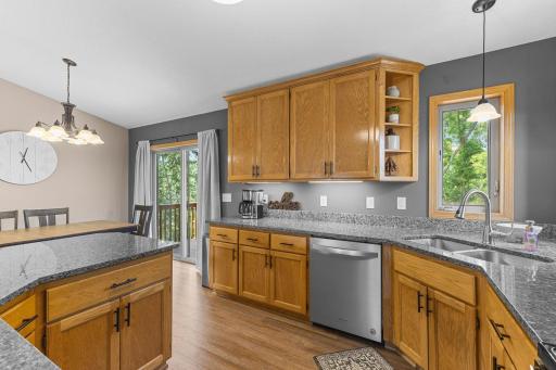Open Kitchen with Granite Counters & Accent Lighting
