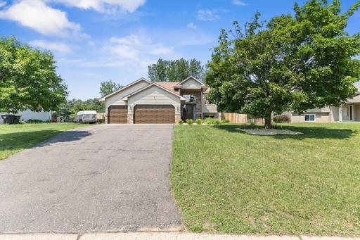 Long asphalt driveway for guest parking and additional parking by garage