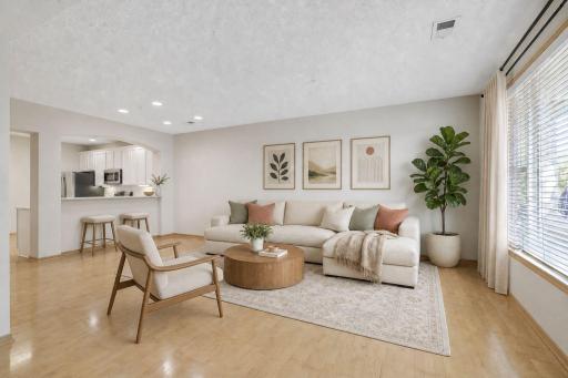 Lovely main level living room with hardwood floors - virtually staged. The home has recently been professionally painted throughout.