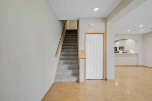 Front spacious foyer, and a convenient coat closet for guests. There is an additional coat closet just off the garage for the homeowner. Professionally installed new carpeting on the stairs and upper-level.