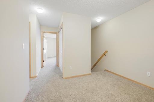 Upper-level loft area. Laundry is just off the second bedroom.