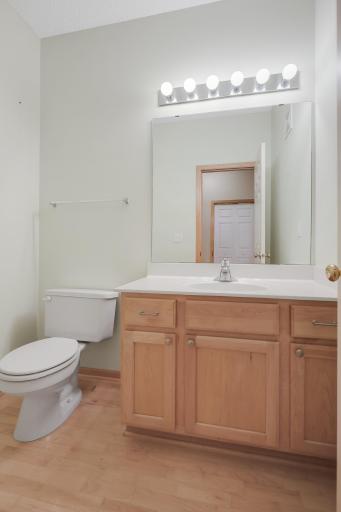 Main-level bathroom conveniently located just off the kitchen for your guests.