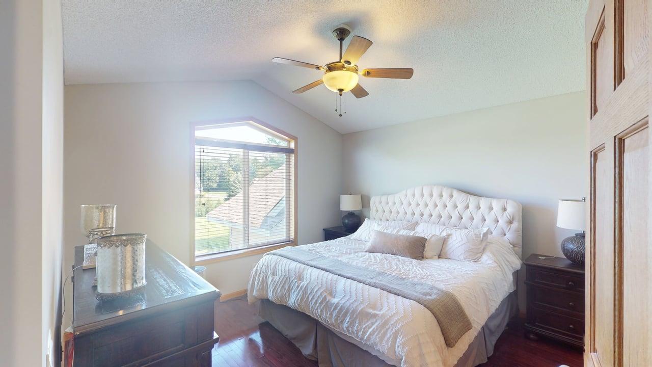 Retreat to the private primary suite complete with a spacious walk-in closet and stylishly updated bath.