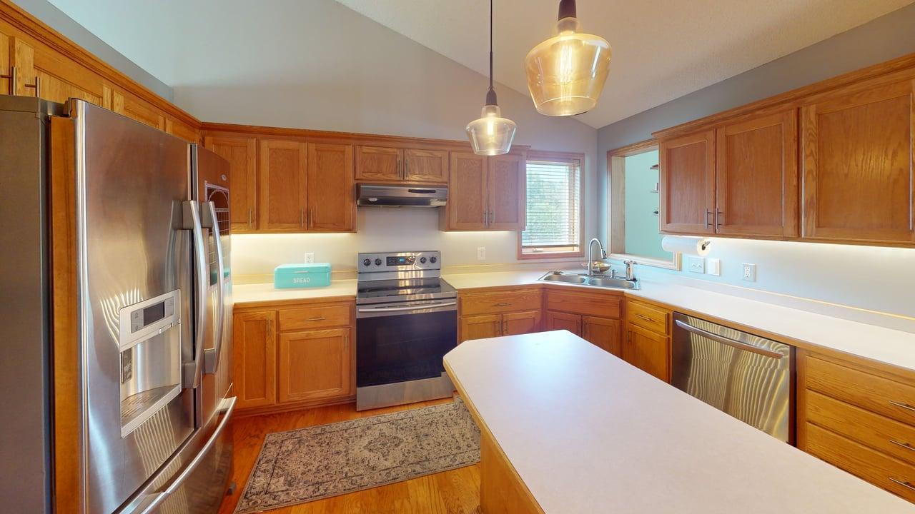 The kitchen offers plenty of cabinetry and workspace to make cooking and entertaining a breeze.
