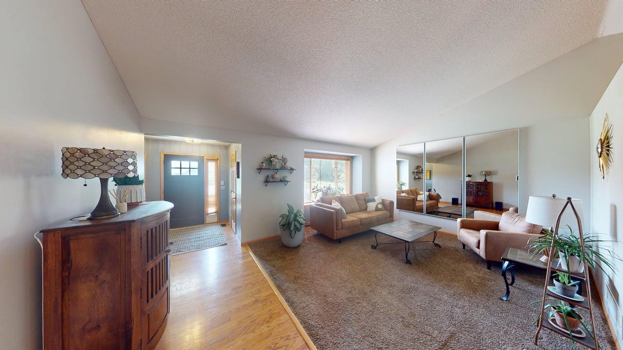 Step inside to find warm hardwood floors and vaulted ceilings that create an open, inviting feel.