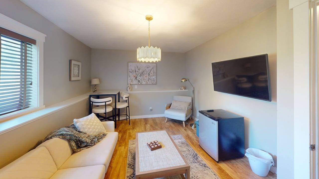 The lower-level family room offers flexible space that could also be used as an additional bedroom.