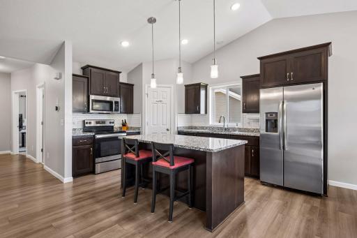 Eat-in kitchen w/ granite counter tops, stainless steel appliances, and island