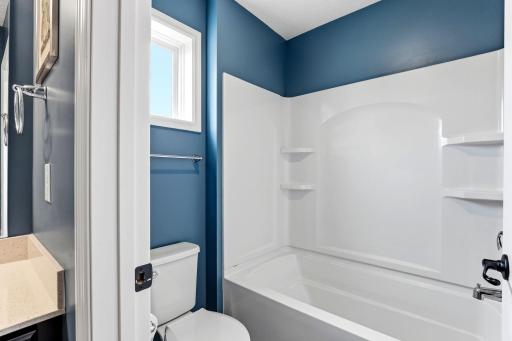 Smart separation: the tub and shower sit in a private compartment, letting two kids get ready at once.