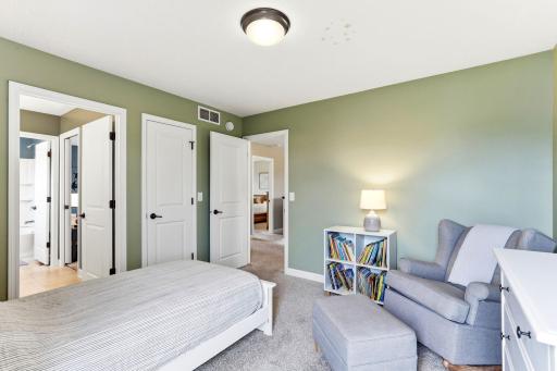 This bedroom adds direct access to the shared bath, with a double closet and room for a reading chair.