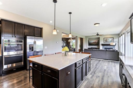 Double wall ovens, a gas cooktop, and generous prep space handle everything from weeknight dinners to holiday feasts.