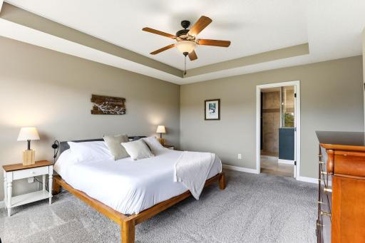 Room for a king and a sitting area, with the ensuite and walk-in closet just beyond.
