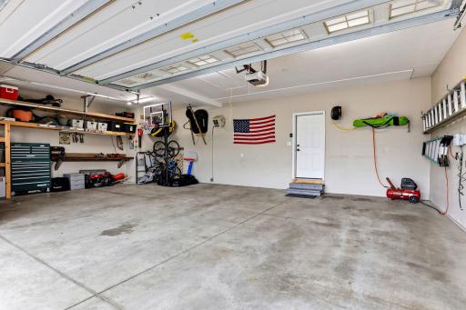 The three car garage comes ready to work, with storage shelving, workbench space, and room for all the toys.