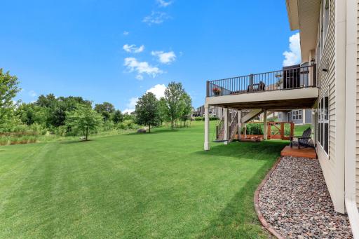 Flat, usable, and beautifully kept, the backyard rolls out room for games, gardens, and gatherings.