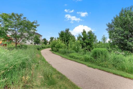 Miles of walking and biking paths start just past the backyard, an everyday perk of this Victoria setting.