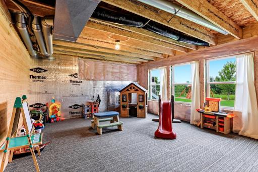 Daylight windows brighten the play zone, proof the lower level already earns its keep.