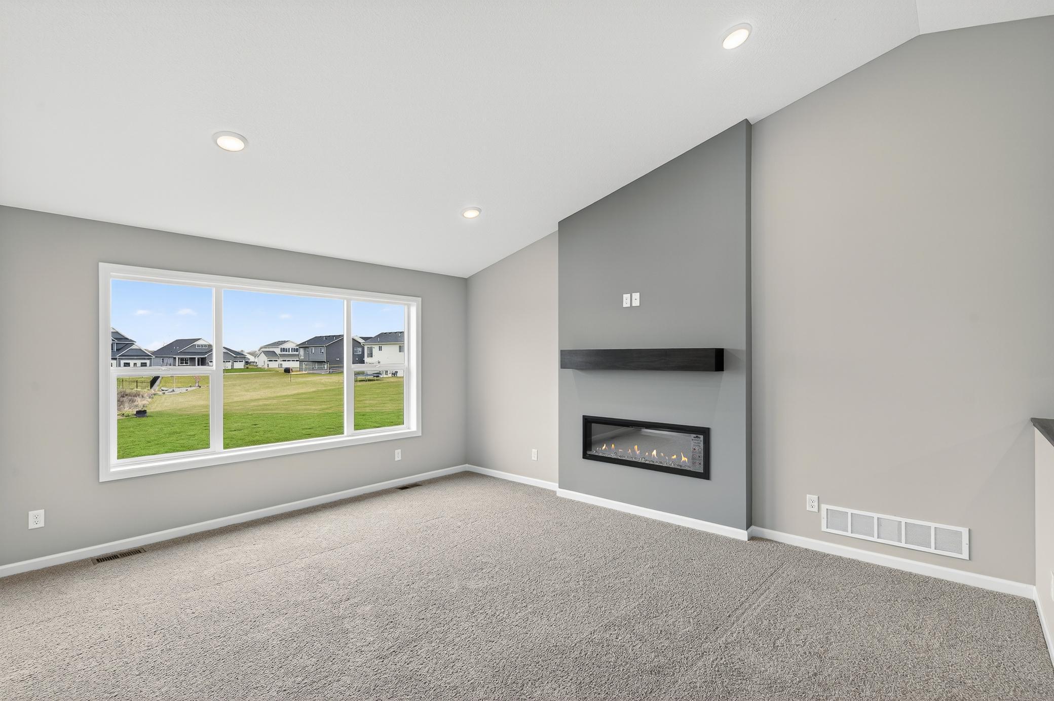 Living room - photos are of a completed home of the same floorplan. Selections and colors may differ.